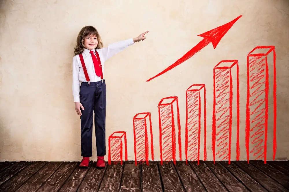 Rozwój dzieci i młodzieży symbolizowany przez rosnący wykres i dziecko wskazujące wzrost